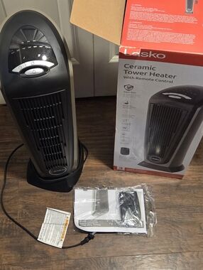 Lasko 1500W Ceramic Tower Space Heater with Remote, Thermostat, Timer & Widespre